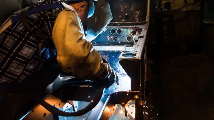 A man is doing the welding stainless steel